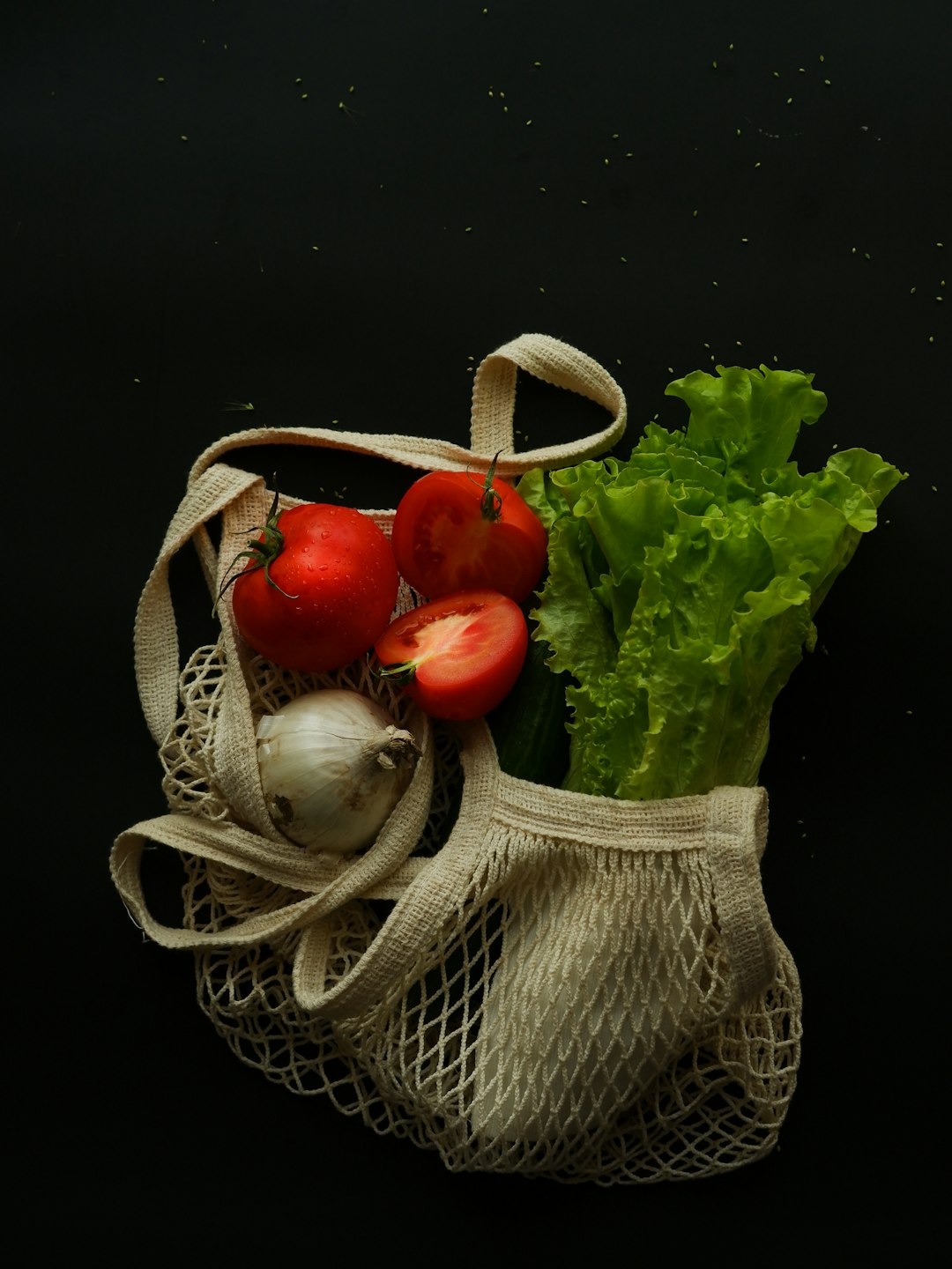 Budget-friendly eco swaps: reusable grocery bags with fresh produce instead of plastic bags