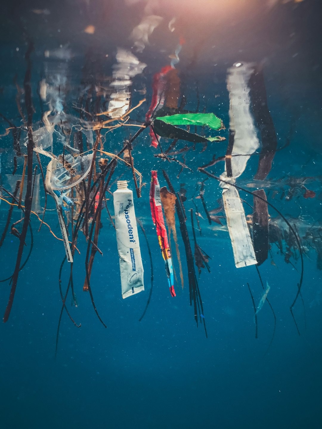 Plastic pollution in oceans highlighting sustainability challenges.