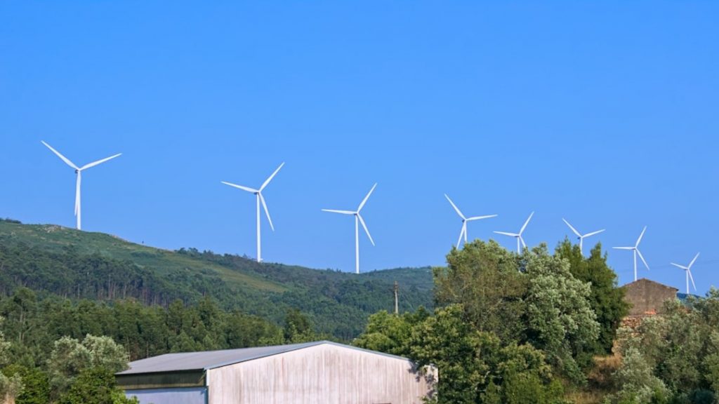 Wind turbines generating renewable energy in 2025 as part of ISO sustainability standards and ESG goals